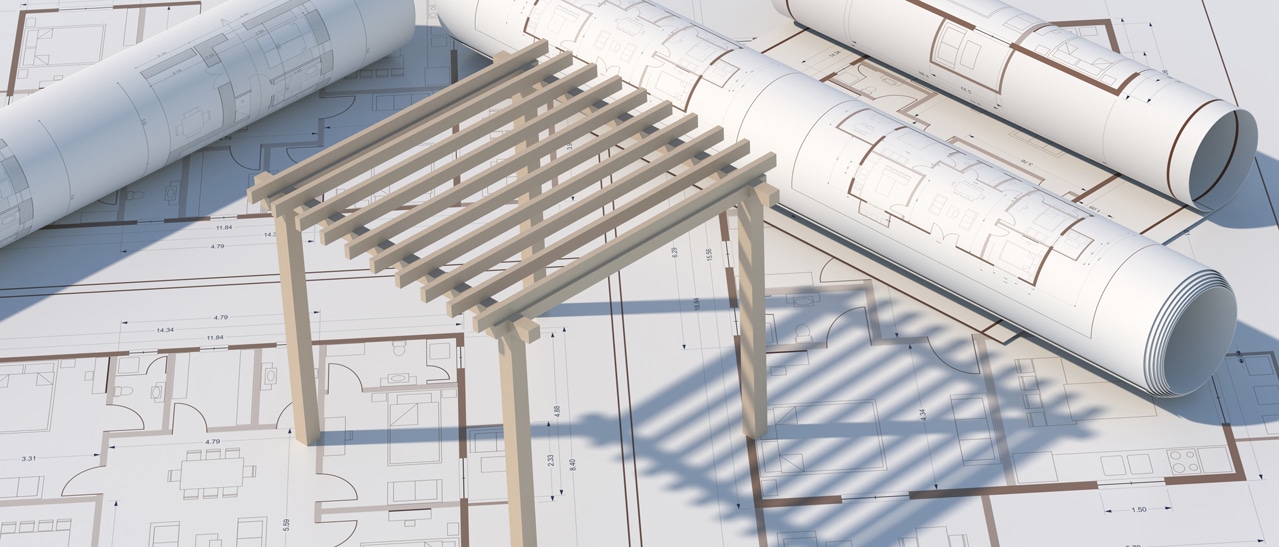 Genehmigungspflichten bei der Baubehörde - Baupläne und Modell für Terrassenüberdachung auf Tisch.