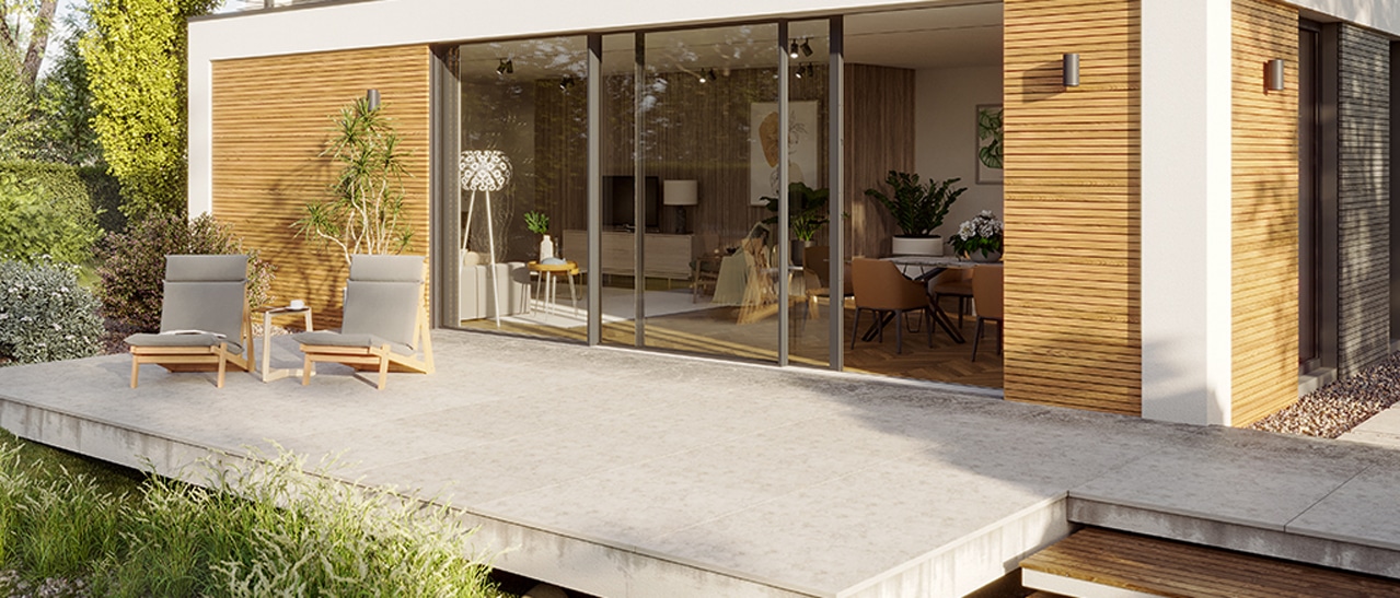 Modernes Tiny House mit bodentiefen Schiebefenstern, die den Innenraum platzsparend öffnen und einen komfortablen Zugang zur Terrasse ermöglichen.