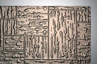 Bronzefarbenes Ornamentglas mit rechteckiger, steinähnlicher Struktur namens Travertino bronze.