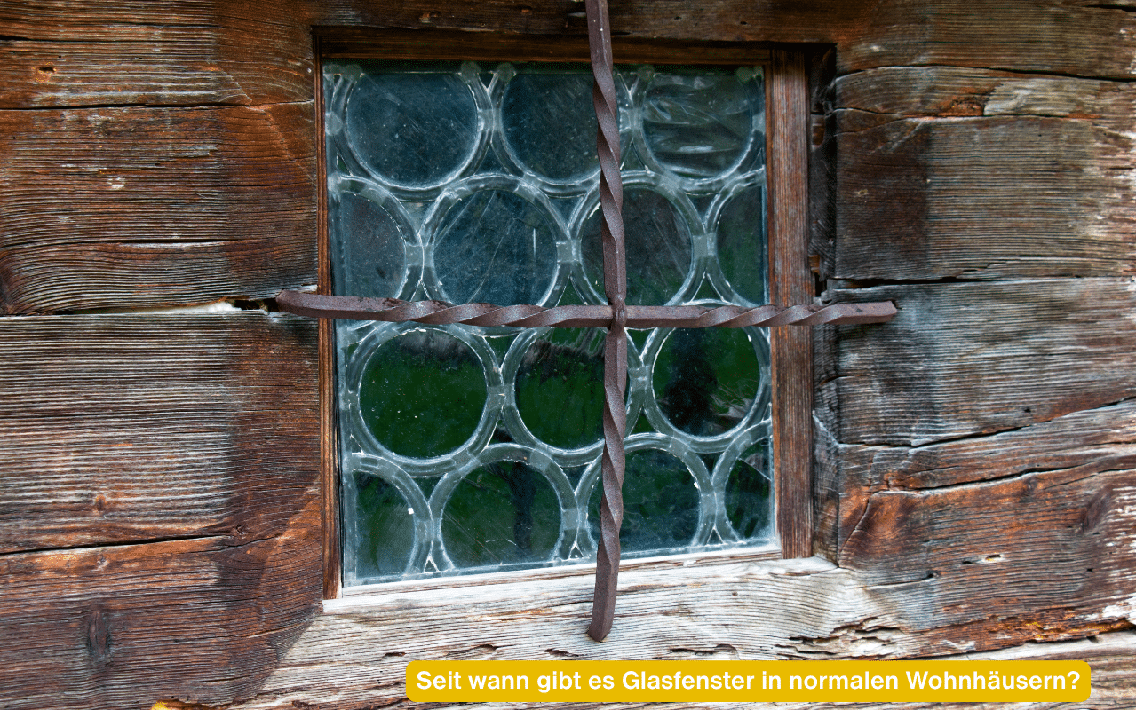 Seit wann gibt es Glasfenster in normalen Wohnhäusern? Altes Holzfenster mit runden Butzenscheiben