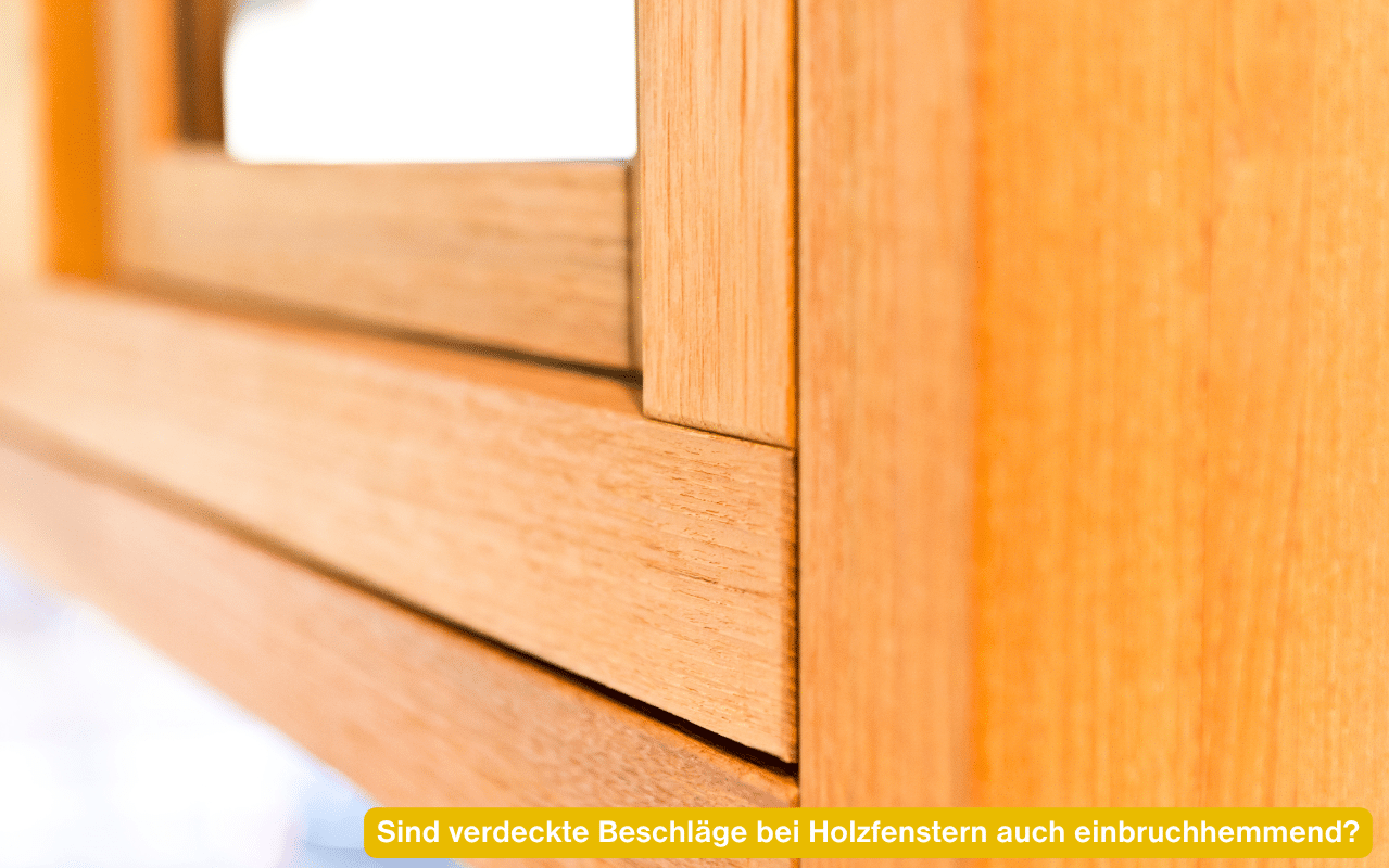 Sind verdeckte Beschläge bei Holzfenstern auch einbruchhemmend? Nahaufnahme eines geschlossenen Holzfensters
