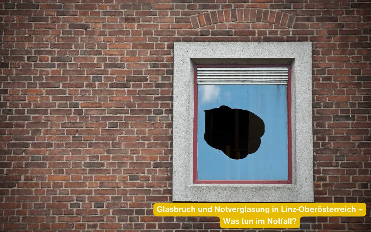Zerstörte Scheibe in einer Ziegelwand. Glasbruch und Notverglasung in Linz-Oberösterreich – Was tun im Notfall?